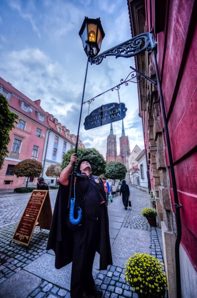 The Wroclaw's lamplighter at work