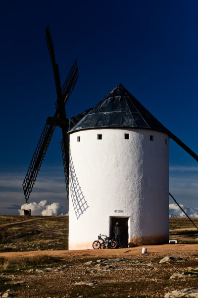 Windmills of La Mancha -Modern Sancho A windmill and a motorbiki in Campo de Criptana